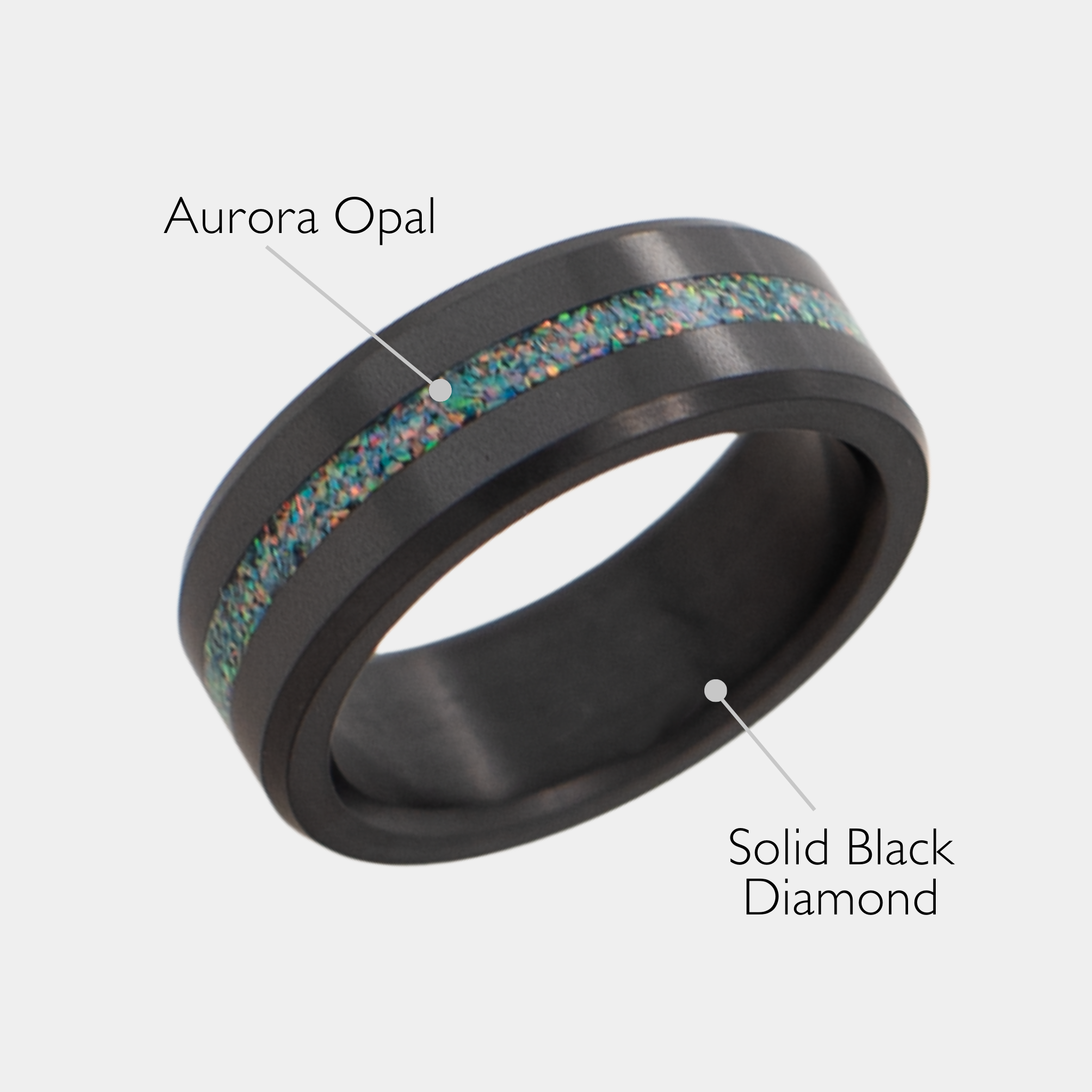 Solid Black Diamond ring with aurora opal inlay on a grey background