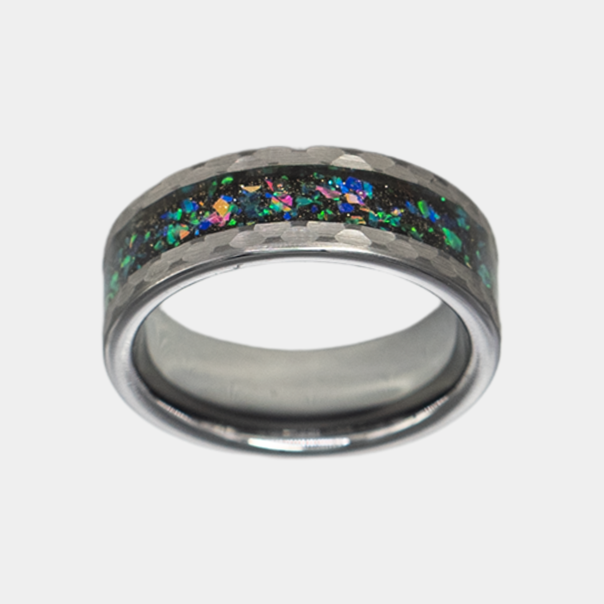 Typhon ring – Hammered Silver Tungsten featuring a Crushed Opal Inlay from the Hustler Collection. Top-down view showcasing ring face.