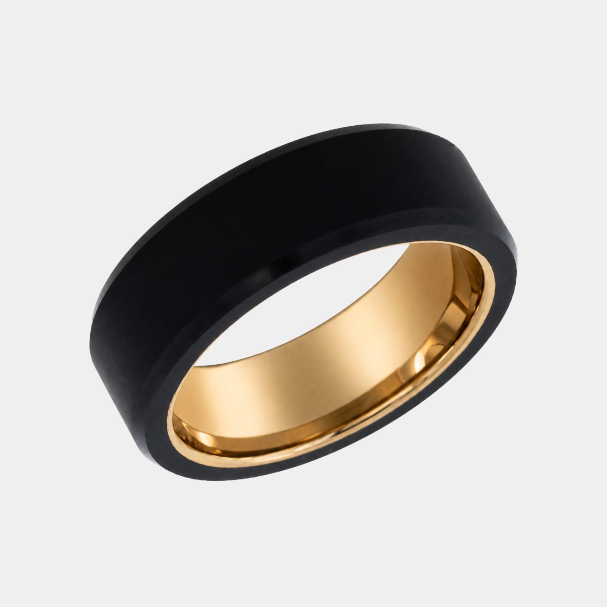 ARES 8mm polished solid black diamond wedding band with a yellow gold sleeve in a three-quarter studio view